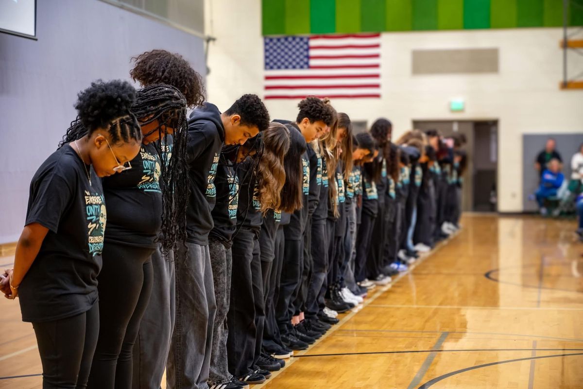 The Salk Middle School Diversity club stands at an assembly. (Courtesy)