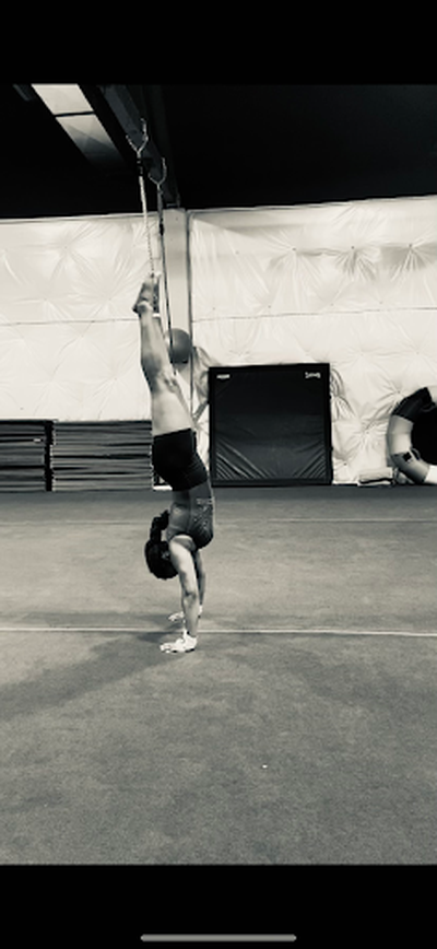 Gymnastics athlete Arnetta Mitchell does a handstand.  (Courtesy)