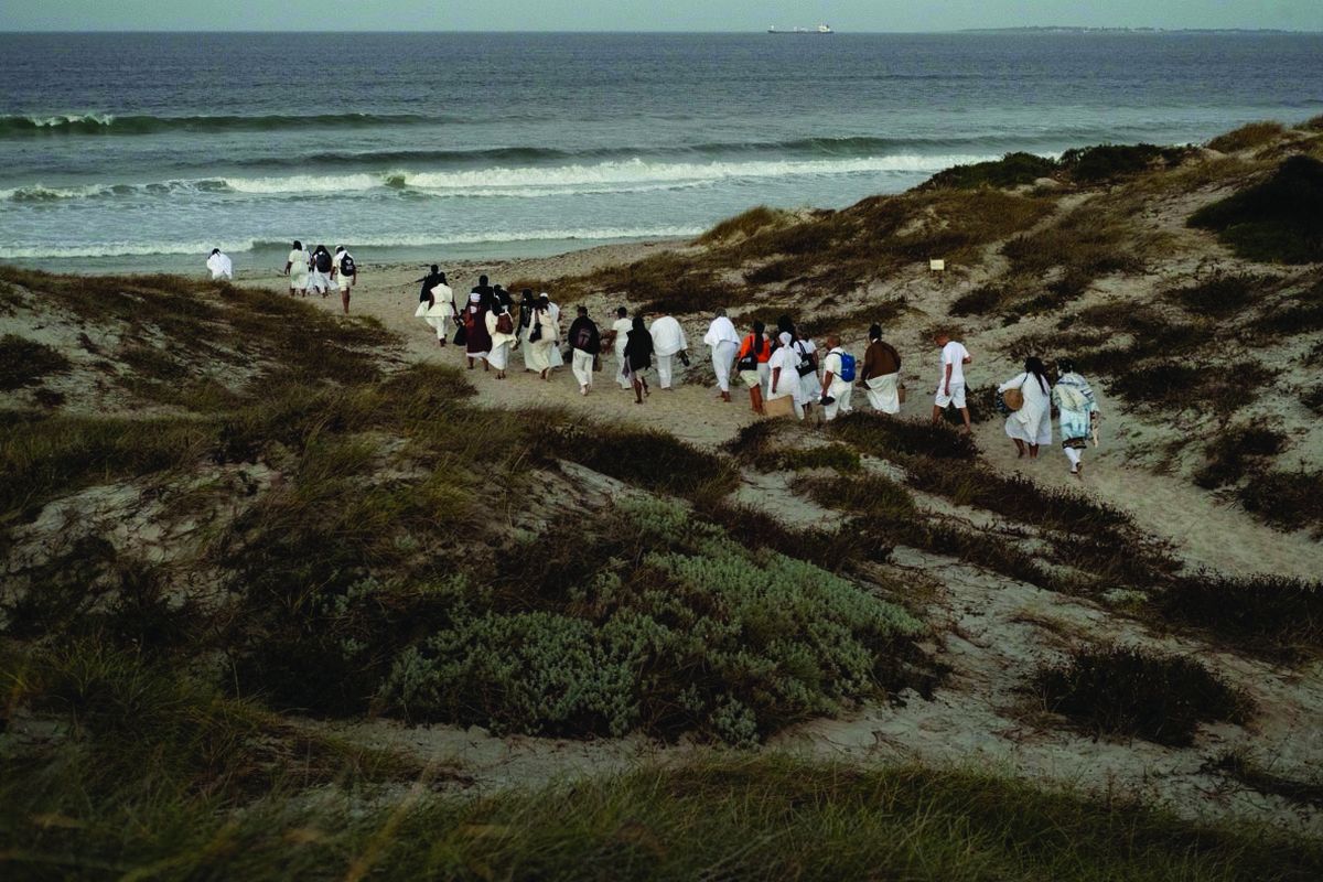 Participants gather for a welcome home ceremony in the Atlantic Ocean  (Black Future Co-op Fund)