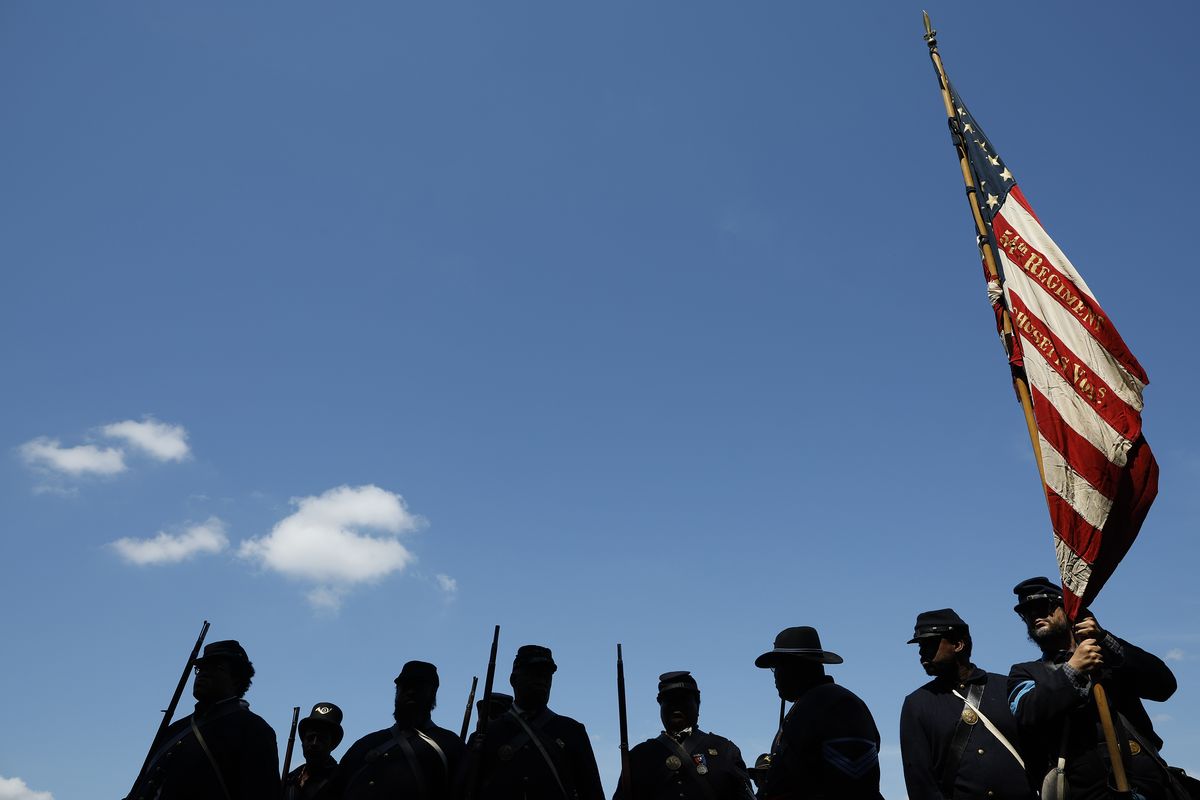 Members of the U.S. Colored Troops and Buffalo Soldiers, living historians and re-enactors from Maryland, Georgia, Massachusetts and other states, prepare to march in the Juneteenth People’s Parade on June 19 in Washington, D.C. (Getty Images)