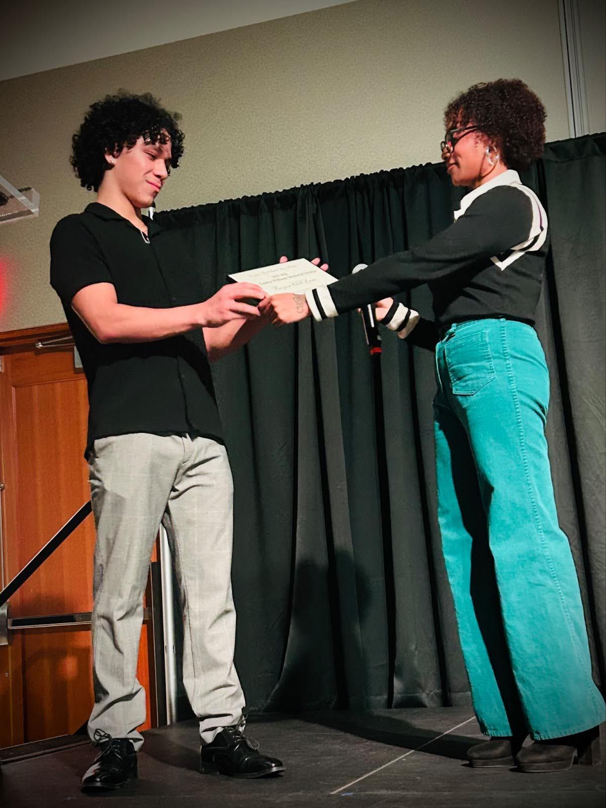 Amari Troutt presents Bryan Chel Lara with the 2025-26 Sandra Williams Memorial Scholarship. (Courtesy)