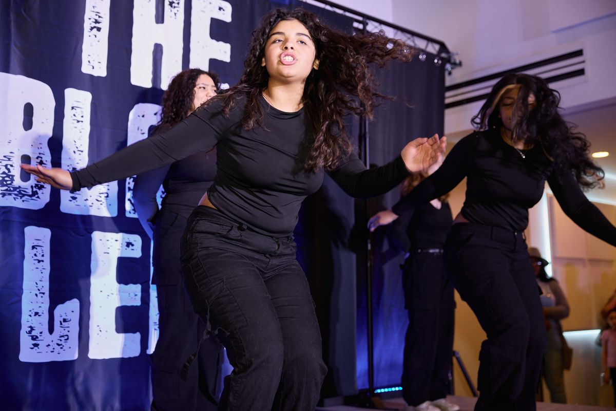 Members of the Step Team Alliance perform at The Black Lens relaunch party Feb. 2 at the Steam Plant rooftop event center. (Ulysses Curry/Innatai Foundation)