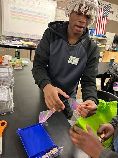 Jarell Hadley demonstrates what a pharmacy tech does in the classroom.  (Courtesy )