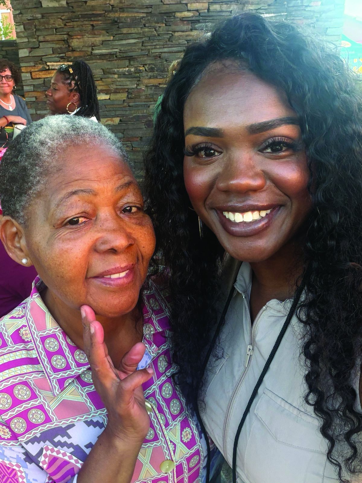 Kitara Johnson-Jones (right) stands with Antoinette Sithole, sister of Hector Pieterson, during a visit to South Africa.  (Kitara Johnson-Jones)