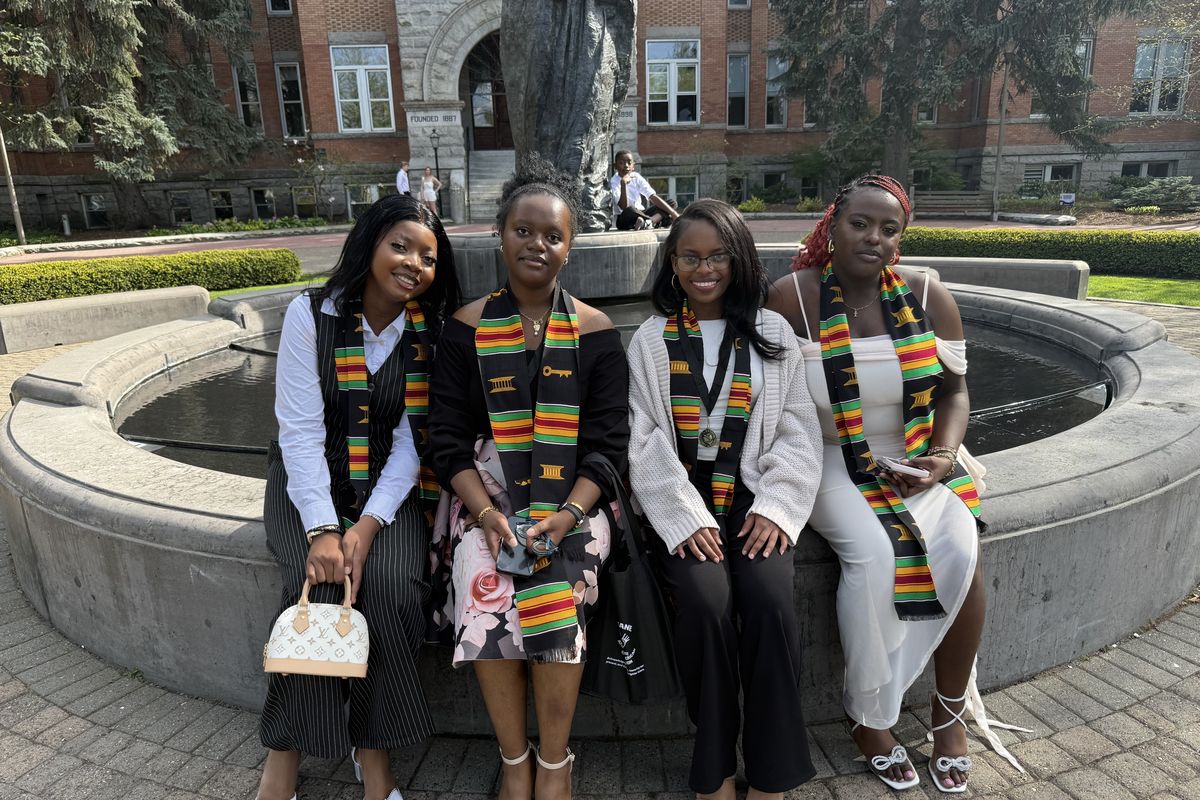 Shadle Park High School graduates Daniella Musesambili, Keren Fataki, Nikita Habimana and Florence Gitau are recognized during the ceremony.