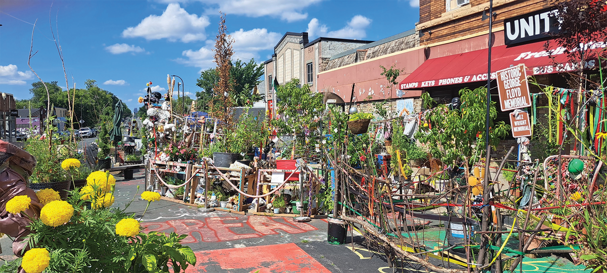 The George Floyd Memorial teaming with floral symbols of hope in Minneapolis, MN.  (Kurtis Robinson)