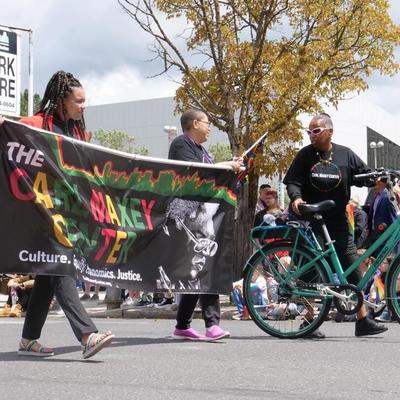 Sandy Williams marches with the Carl Maxey Center during a Pride Parade. Williams was named the Over the Rainbow Grand Marshal of Pride in 2019.  (Courtesy of Spokane Pride)